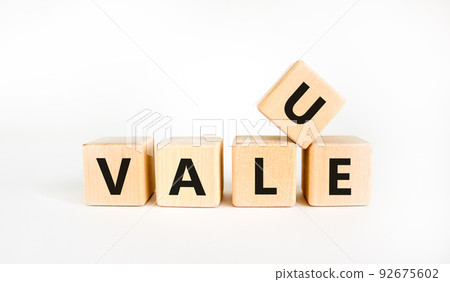 Value symbol. The concept word 'value' on wooden cubes on a beautiful white table, white background, copy space. Business and value concept. 92675602