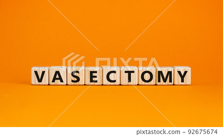 Vasectomy symbol. Concept words Vasectomy on wooden blocks. Beautiful orange table orange background. Medical and vasectomy problem concept. Conceptual image. Copy space. Vasectomy symbol. Concept words Vasectomy on wooden blocks. Beautiful orange table orange background. Medical and vasectomy problem concept. Conceptual image. Copy space. 92675674