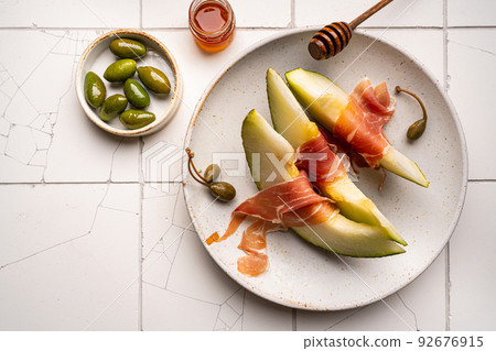 Jamon or prosciutto with melon Jamon or prosciutto with melon 92676915