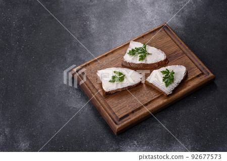 Sliced bread with cream cheese and butter for breakfast Sliced bread with cream cheese and butter for breakfast 92677573