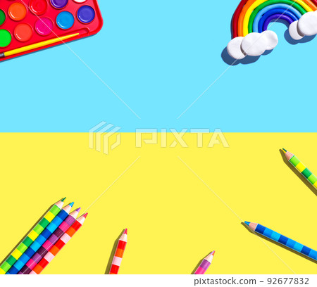 Art supplies with a rainbow - flat lay 92677832