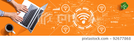 Wifi theme with person using a laptop 92677868