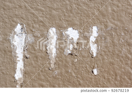 Series of scratches and dents in drywall where the paint as been removed. 92678219