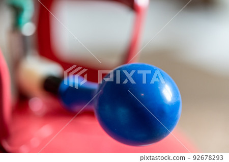 Selective focus on edge of an inflatable balloon attached to a helium canister. 92678293