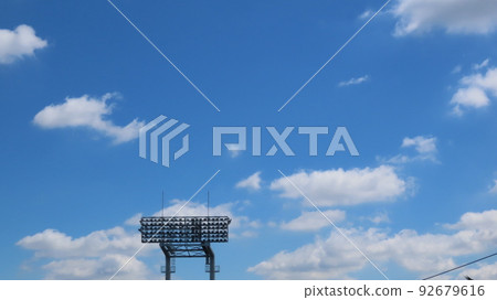 Blue sky and stadium lighting Blue sky and stadium lighting 92679616