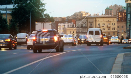 Moscow centre cityscape behind blurred road traffic in the evening 92680068