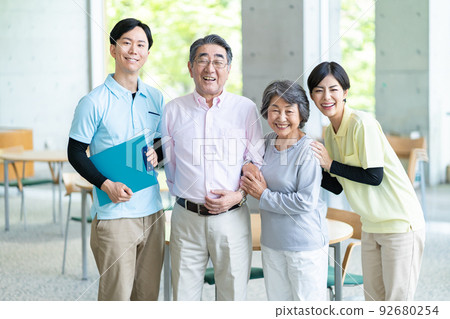 Caregiver and senior couple Caregiver and senior couple 92680254