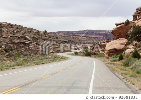 Scenic Road surrounded by Red Rock Mountains in the Desert. Scenic Road surrounded by Red Rock Mountains in the Desert. 92681835