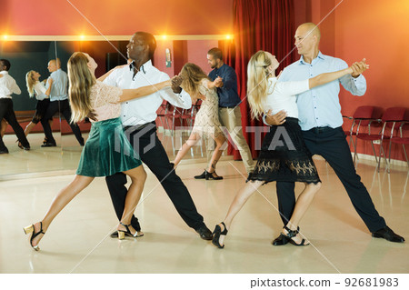 People dancing slow ballroom dances in pairs 92681983