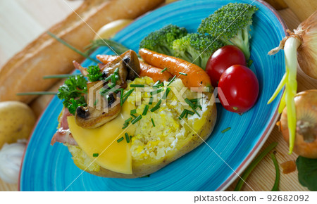 Baked potato with bacon, vegetables, mushrooms 92682092