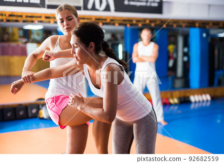 Young woman training knee strike 92682559