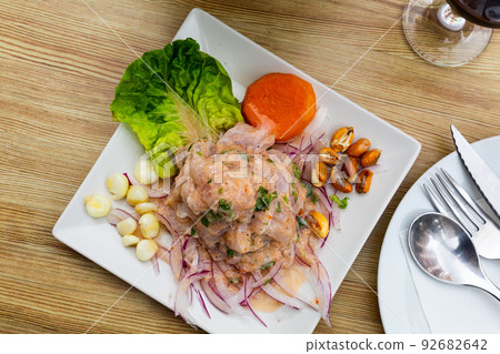 Peruvian ceviche from alaska pollock with onion and garlic Peruvian ceviche from alaska pollock with onion and garlic 92682642