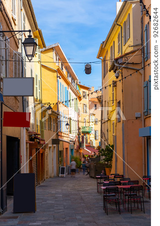 Narrow streets in French town of Hyeres in summer day Narrow streets in French town of Hyeres in summer day 92682644