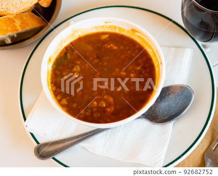 Spanish lentil stew served on table Spanish lentil stew served on table 92682752