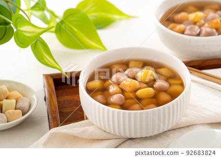 Delicious sweet taro ball soup in a white bowl for serving. Delicious sweet taro ball soup in a white bowl for serving. 92683824