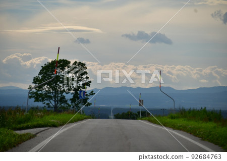 A straight road that seems to continue forever A straight road that seems to continue forever 92684763