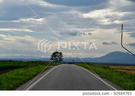 A straight road that seems to continue forever A straight road that seems to continue forever 92684765