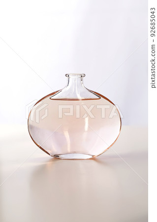 Bottle of perfume on white background 92685043