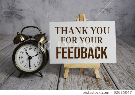 Thank you for your Feedback text message and alarm clock on wooden background Thank you for your Feedback text message and alarm clock on wooden background 92685047