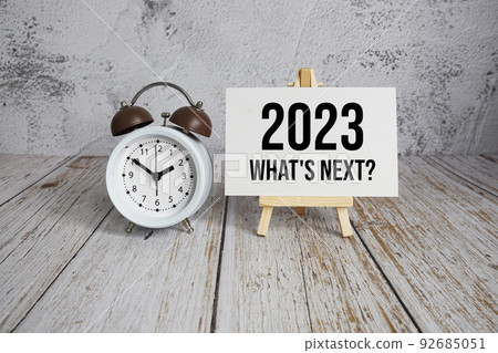 2023 What's Next? text message and alarm clock on wooden background 2023 What's Next? text message and alarm clock on wooden background 92685051