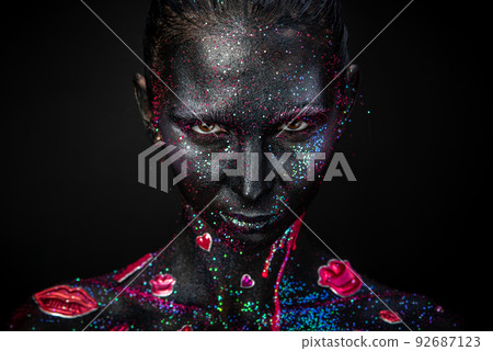 Mystical makeup of a woman in the dark Mystical makeup of a woman in the dark 92687123