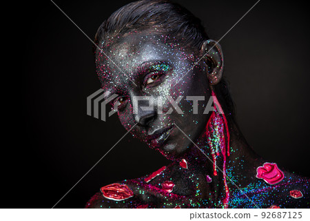 Mystical makeup of a woman in the dark Mystical makeup of a woman in the dark 92687125