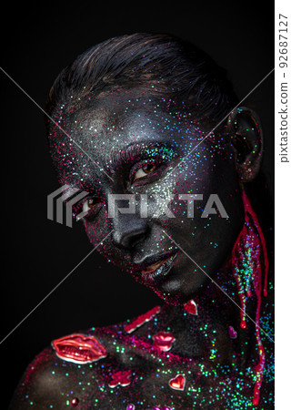 Mystical makeup of a woman in the dark Mystical makeup of a woman in the dark 92687127