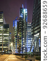 View of illuminated skyscrapers in City of London at night. 92688659