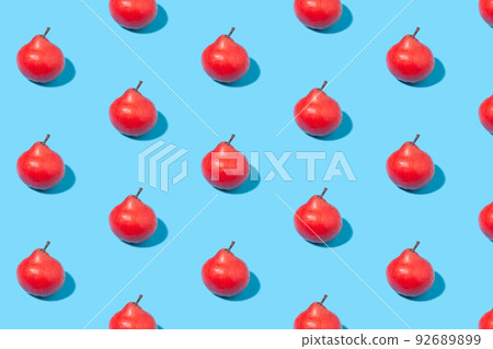 Red ripe pears on a blue background 92689899