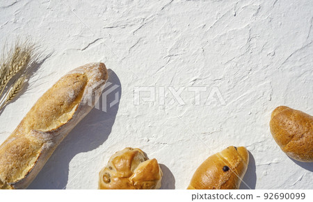 Baguette and wheat on white background 92690099