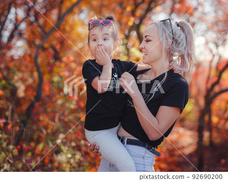 Beautiful young happy mother with little girl. Beautiful young happy mother with little girl. 92690200