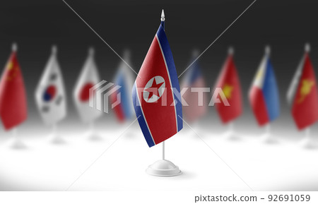 The national flag of the North Korea on the background of flags of other countries 92691059
