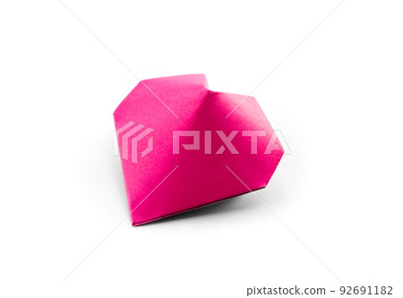 Pink paper heart origami isolated on a white background 92691182