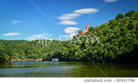Beautiful old castle Veveri. Landscape with water on the Brno dam during summer holidays on a sunny day. Czech Republic - Brno. 92691796