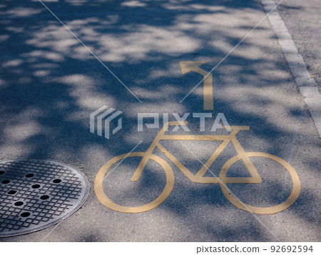 yellow bicycle sign on bike lane yellow bicycle sign on bike lane 92692594