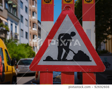 Man At Work Sign On Road Man At Work Sign On Road 92692608