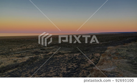 Panorama view to Aral sea from the rim of Plateau Ustyurt near Aktumsuk cape at sunset, Karakalpakstan, Uzbekistan Panorama view to Aral sea from the rim of Plateau Ustyurt near Aktumsuk cape at sunset, Karakalpakstan, Uzbekistan 92693100