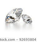 two diamods on a white reflective background 92693804