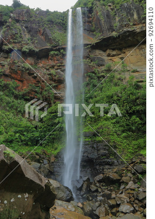 Iriomote Island's Pinaisara Falls with a drop of 54 meters Iriomote Island's Pinaisara Falls with a drop of 54 meters 92694110