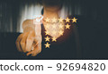 A woman favorite mark is marked as satisfied with 5 stars, and customer satisfaction provides the best service. 92694820