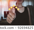 woman thumbs up with smiling face To give a 5-star satisfaction rating, customers give a very good service satisfaction rating of 5 stars. 92694825