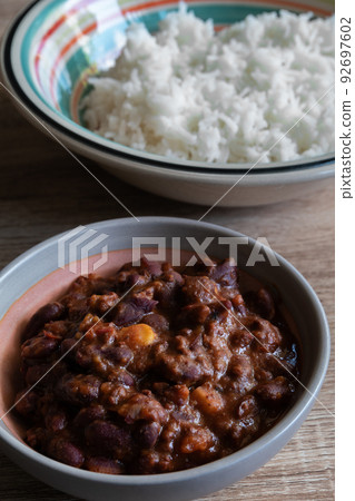 Chili con carne in a bowl with white rice Chili con carne in a bowl with white rice 92697602