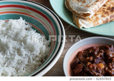Chili con carne in a bowl with white rice Chili con carne in a bowl with white rice 92697603