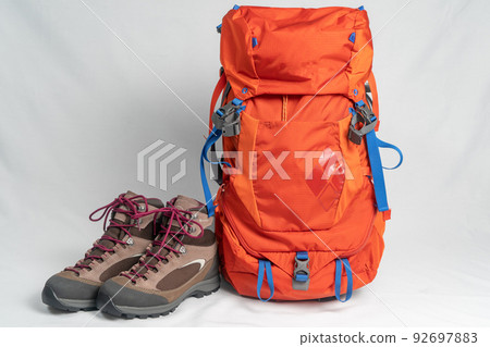 hiking boots and backpack 92697883