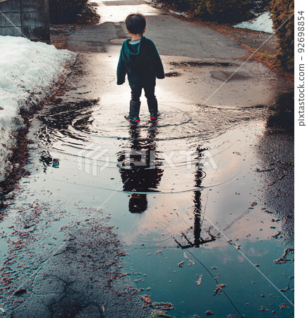The world reflected in the puddle 92698854