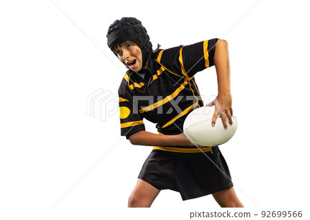 One sportive boy, kid, male rugby player training with ball isolated on white background with grass floooring. Sport, team, studying, skills concept One sportive boy, kid, male rugby player training with ball isolated on white background with grass floooring. Sport, team, studying, skills concept 92699566