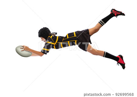 Dynamic shot sportive boy, kid, male rugby player training with ball isolated on white background. Sport, team, studying, skills concept Dynamic shot sportive boy, kid, male rugby player training with ball isolated on white background. Sport, team, studying, skills concept 92699568