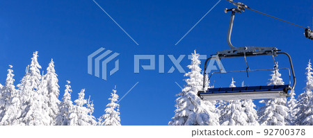 Ski resort, ski lift and snow pine trees Ski resort, ski lift and snow pine trees 92700378