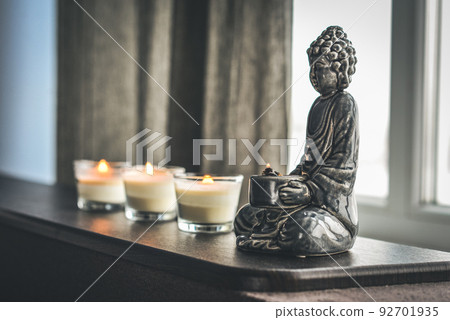 Candlestick in the shape of a buddha 92701935