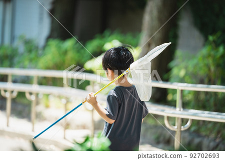 Children catching insects in the park Children catching insects in the park 92702693